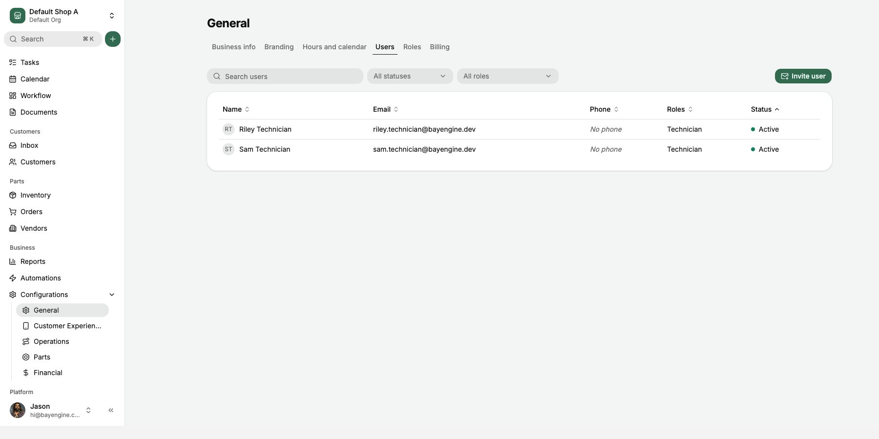 Users page with invite button, roles, and status
